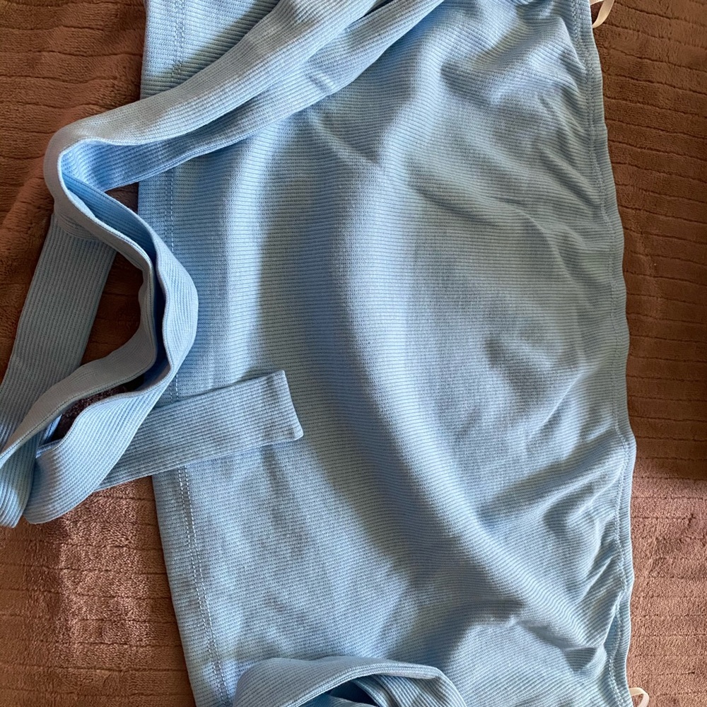 Sky blue tube top with straps to tie around arms